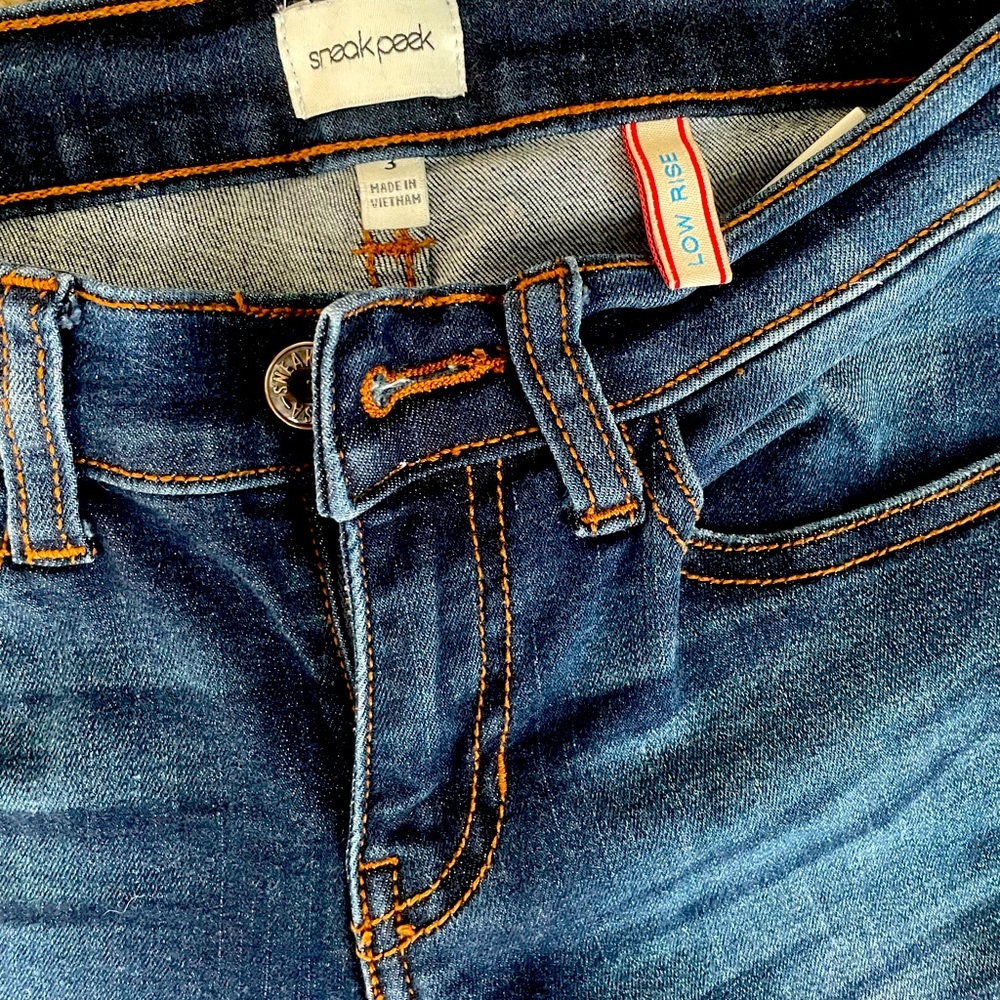 Low rise, skinny, ripped denim jeans
